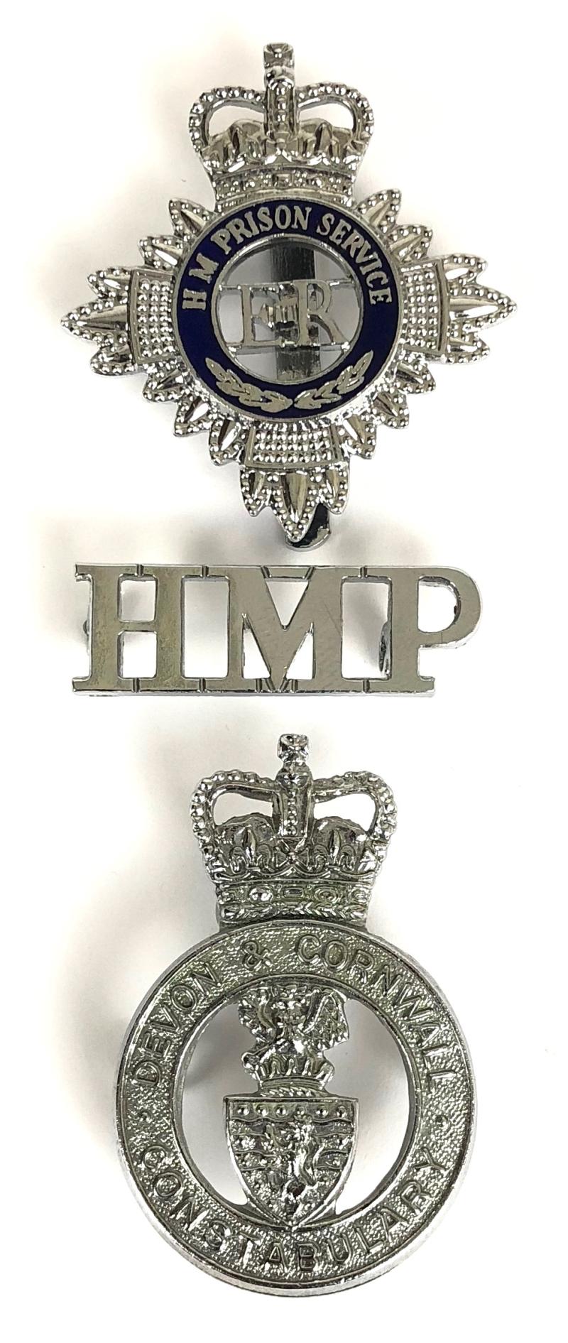 EIIR HM Prison Service shoulder title and cap badge together with Devon & Cornwall Constabulary cap badge