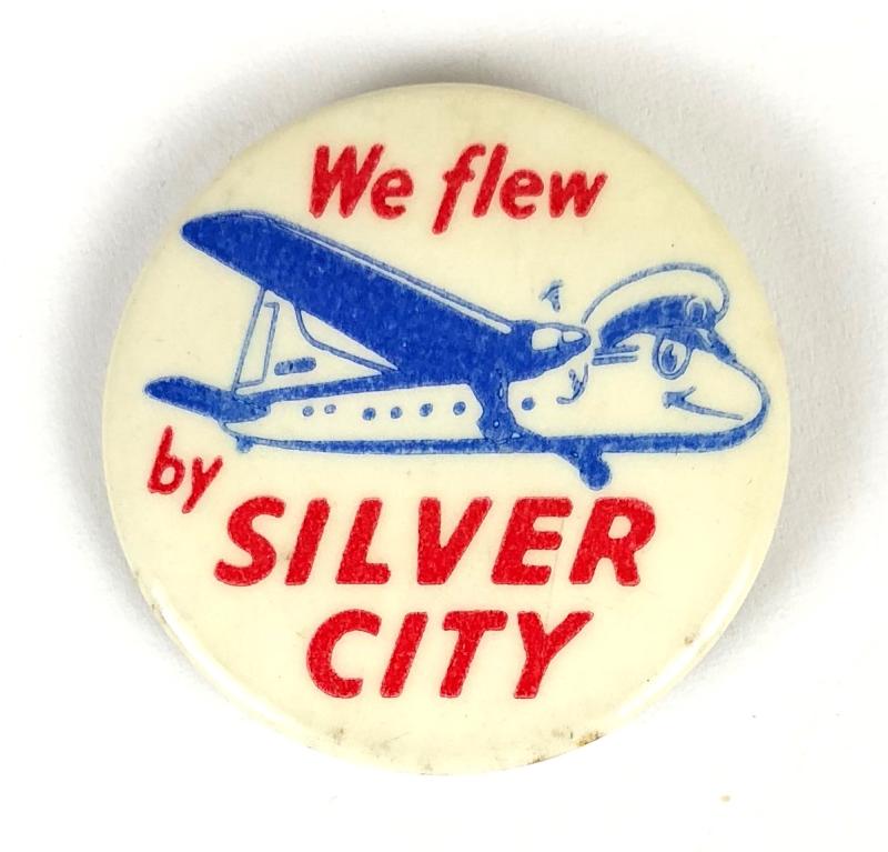 We flew by SILVER CITY humorous promotional tin button badge