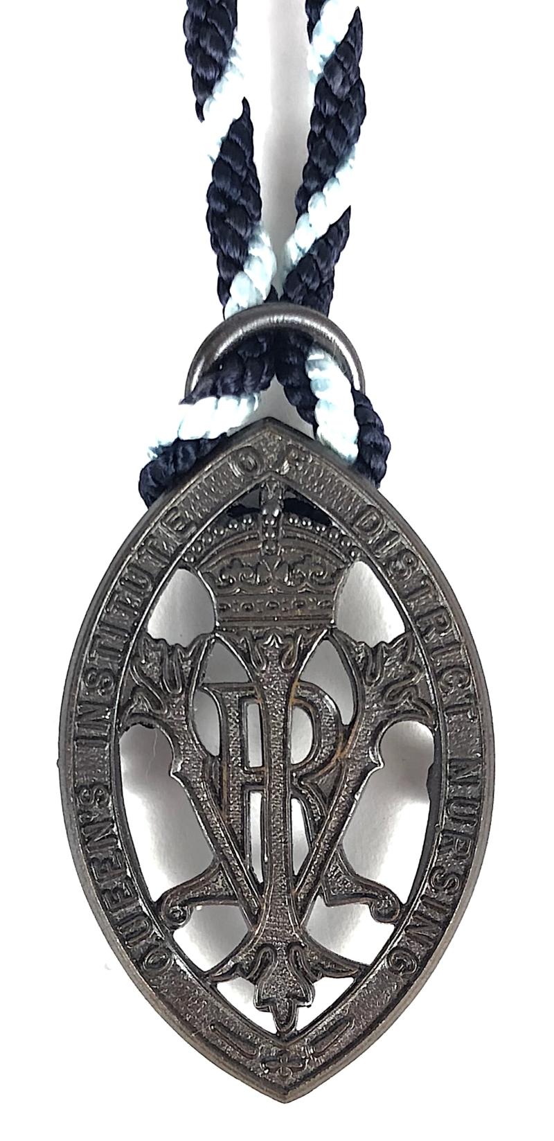Queens Institute of District Nursing bronze badge & neck cord